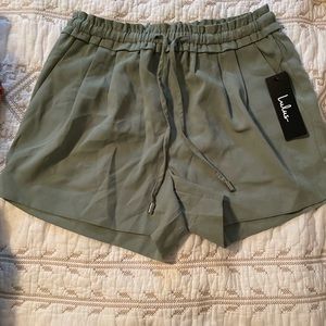 New with tags, size xs, green shorts